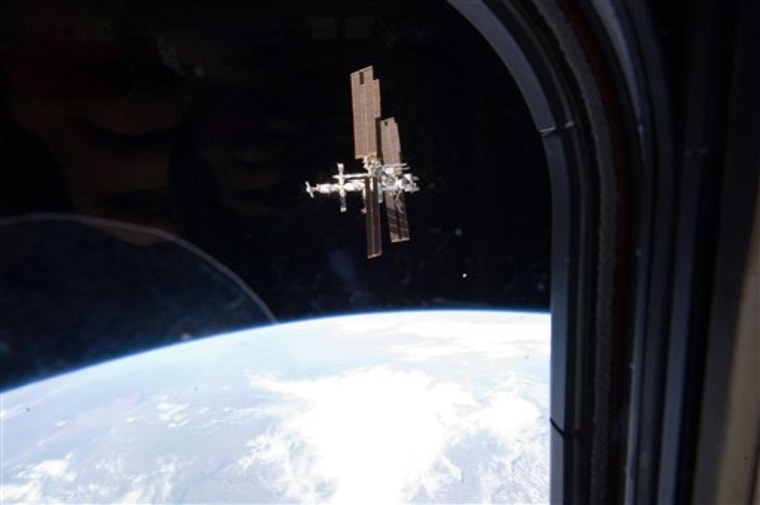This image from NASA shows the International Space Station photographed by a member of Atlantis' STS-135 crew during a fly around as the shuttle departed the station on the last space shuttle mission in July, 2011. A panel of outside experts said Wednesday that NASA is adrift without a coherent vision for where it should be going. 